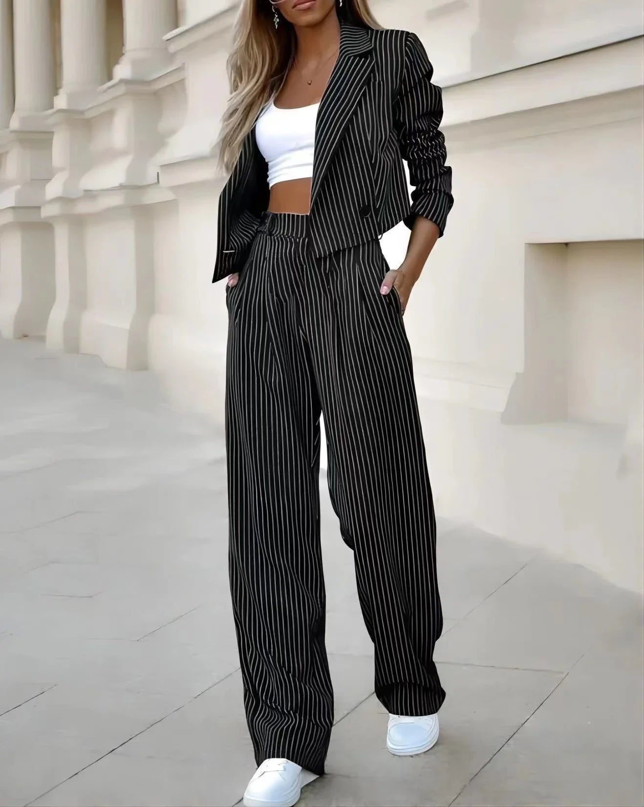 Fashionable striped suit sets featuring cropped tops and straight-leg pants in various color options