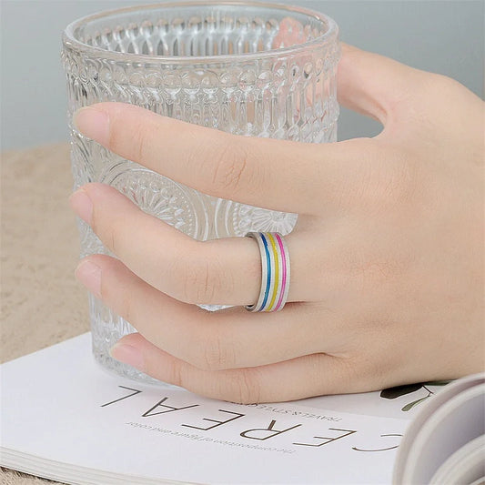 Iridescent titanium steel rings with rainbow-like oil treatment and sleek, flower-inspired design