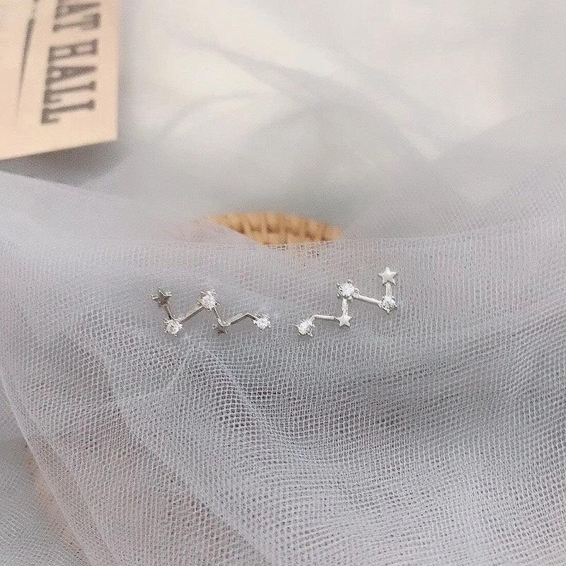 Geometric frosty style stud earrings in gold and silver, showcasing modern design and durability