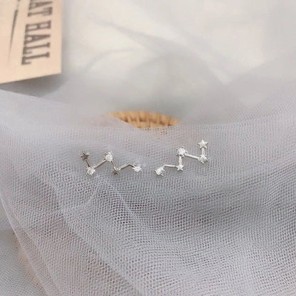 Geometric frosty style stud earrings in gold and silver, showcasing modern design and durability