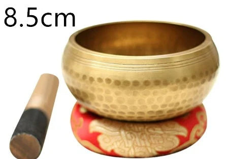 A handcrafted Tibetan singing bowl made of copper, used for meditation and relaxation.