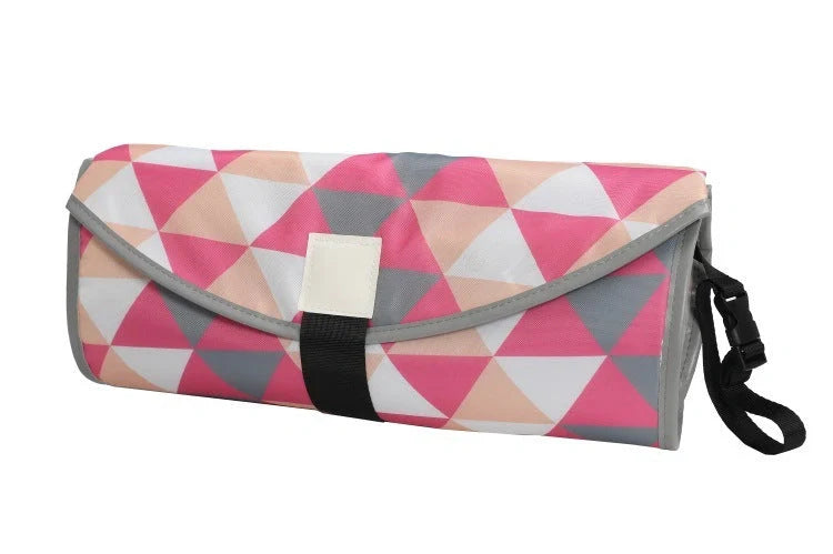 Portable diaper changing pad clutch with built-in toy ring, foldable design for easy transport