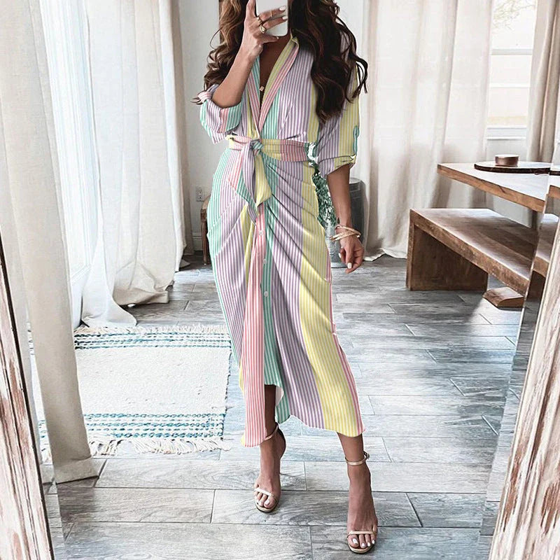 A beautiful floral wrap dress with lace-up detailing, featuring a deep V-neck and full-length skirt for a flattering, elegant look.