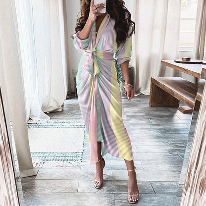 A beautiful floral wrap dress with lace-up detailing, featuring a deep V-neck and full-length skirt for a flattering, elegant look.