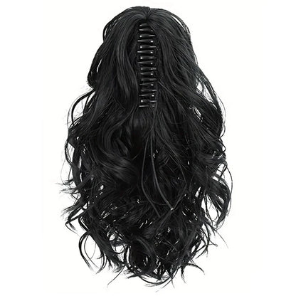 A close-up view of the 12-Inch Short Wavy Claw Clip Ponytail Extension in black, showcasing its natural texture and seamless blending capabilities.