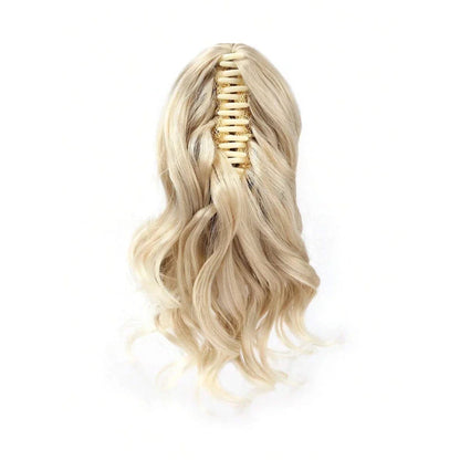 A close-up view of the 12-Inch Short Wavy Claw Clip Ponytail Extension in black, showcasing its natural texture and seamless blending capabilities.