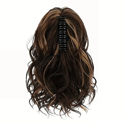 A close-up view of the 12-Inch Short Wavy Claw Clip Ponytail Extension in black, showcasing its natural texture and seamless blending capabilities.