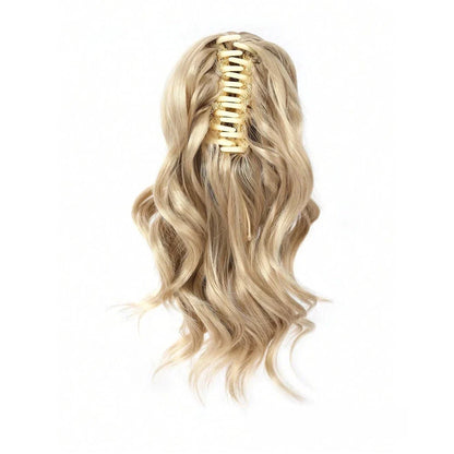 A close-up view of the 12-Inch Short Wavy Claw Clip Ponytail Extension in black, showcasing its natural texture and seamless blending capabilities.