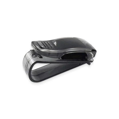 A compact plastic clip that securely holds sunglasses or glasses on a car's sun visor