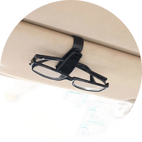 A compact plastic clip that securely holds sunglasses or glasses on a car's sun visor