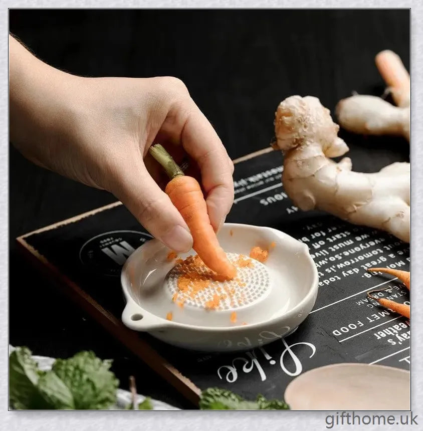 A white ceramic ginger grater, a safe and convenient kitchen tool for grating, mincing, and shredding a variety of ingredients.