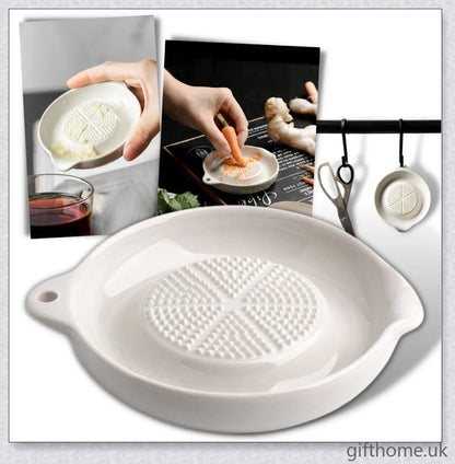 A white ceramic ginger grater, a safe and convenient kitchen tool for grating, mincing, and shredding a variety of ingredients.