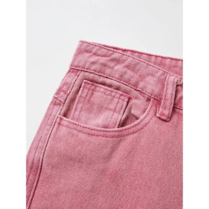 Photograph of a model wearing pink high-waisted, wide-leg jeans with vintage-inspired details