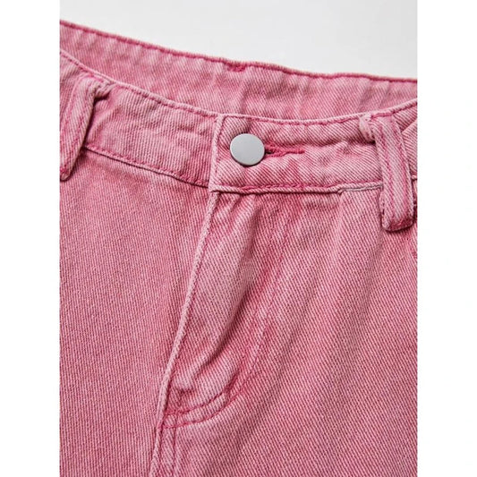 Photograph of a model wearing pink high-waisted, wide-leg jeans with vintage-inspired details