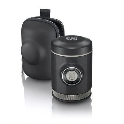Portable espresso maker with a sleek black design, featuring a naked portafilter and manual operation for crafting premium coffee on the go.