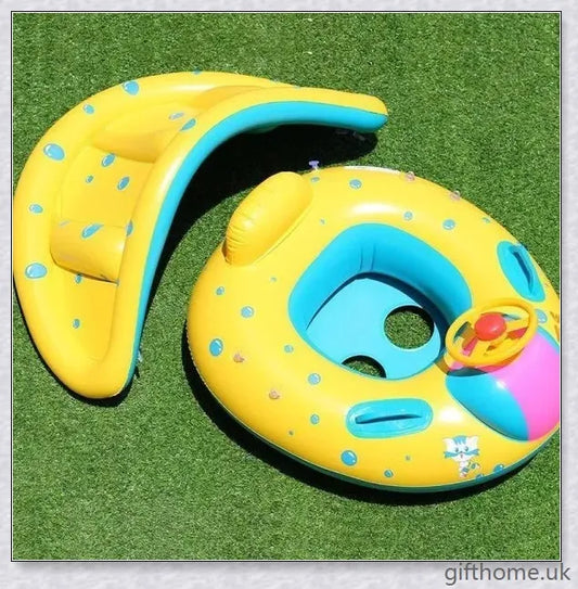 A baby swimming in a blue and white clamshell-style inflatable swimming pool float with a sun canopy and steering wheel