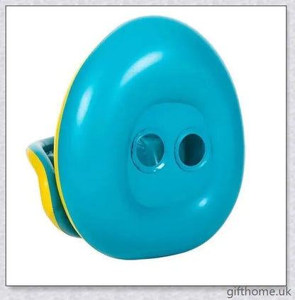 A baby swimming in a blue and white clamshell-style inflatable swimming pool float with a sun canopy and steering wheel