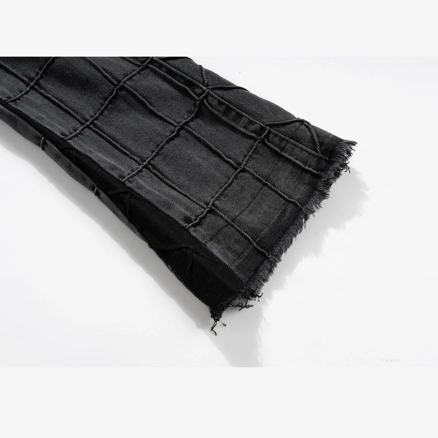 A pair of fashionable waffle-textured denim jeans in black and gray colors, suitable for both men and women.