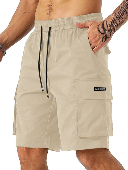 Drawstring waist men's multi-pocket workwear shorts in various colours, designed for comfort and functionality on the job site or for DIY projects.