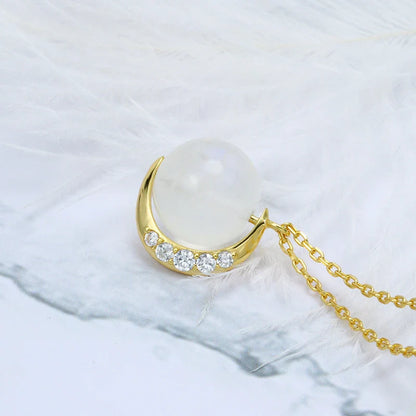 Elegant silver crescent moon necklace with sparkling stones, a timeless celestial accessory