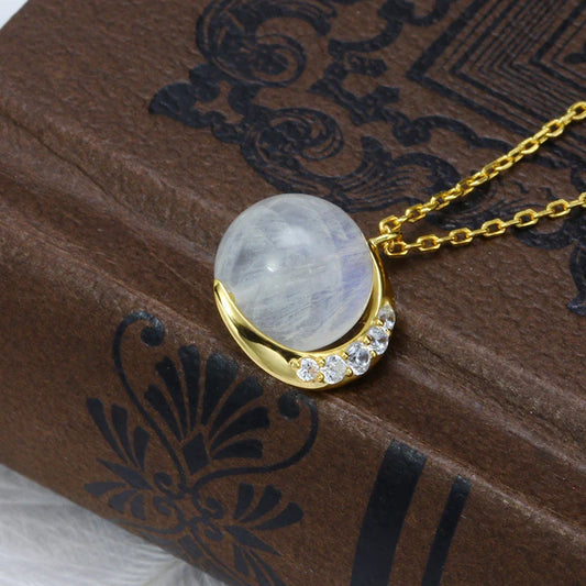 Elegant silver crescent moon necklace with sparkling stones, a timeless celestial accessory