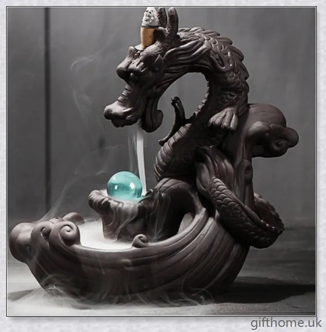 Handcrafted ceramic incense burner with a dragon design and a mesmerising gem at the centre, creating a smoky waterfall effect to diffuse calming aromas.