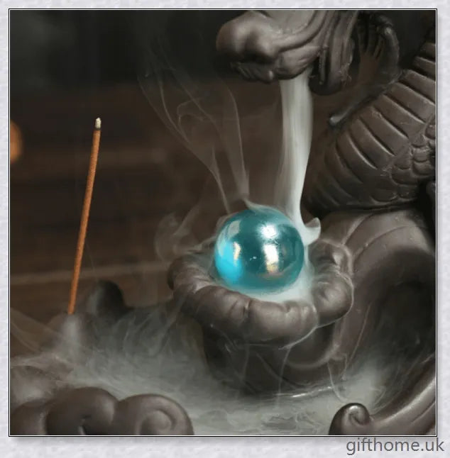 Handcrafted ceramic incense burner with a dragon design and a mesmerising gem at the centre, creating a smoky waterfall effect to diffuse calming aromas.