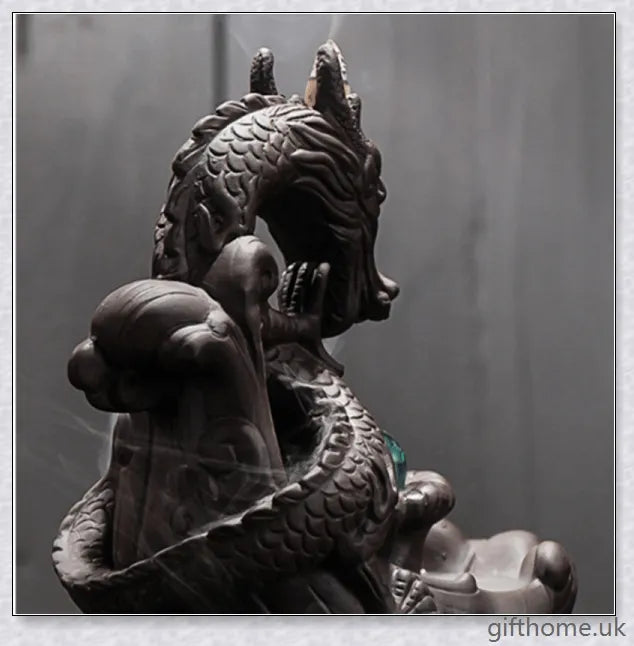 Handcrafted ceramic incense burner with a dragon design and a mesmerising gem at the centre, creating a smoky waterfall effect to diffuse calming aromas.
