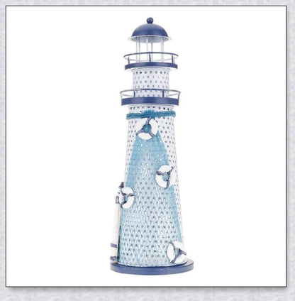 Oceanica LED Lighthouse Lantern Nightlight with nautical details like a small boat, life buoy, and seashells, providing a soft warm glow.