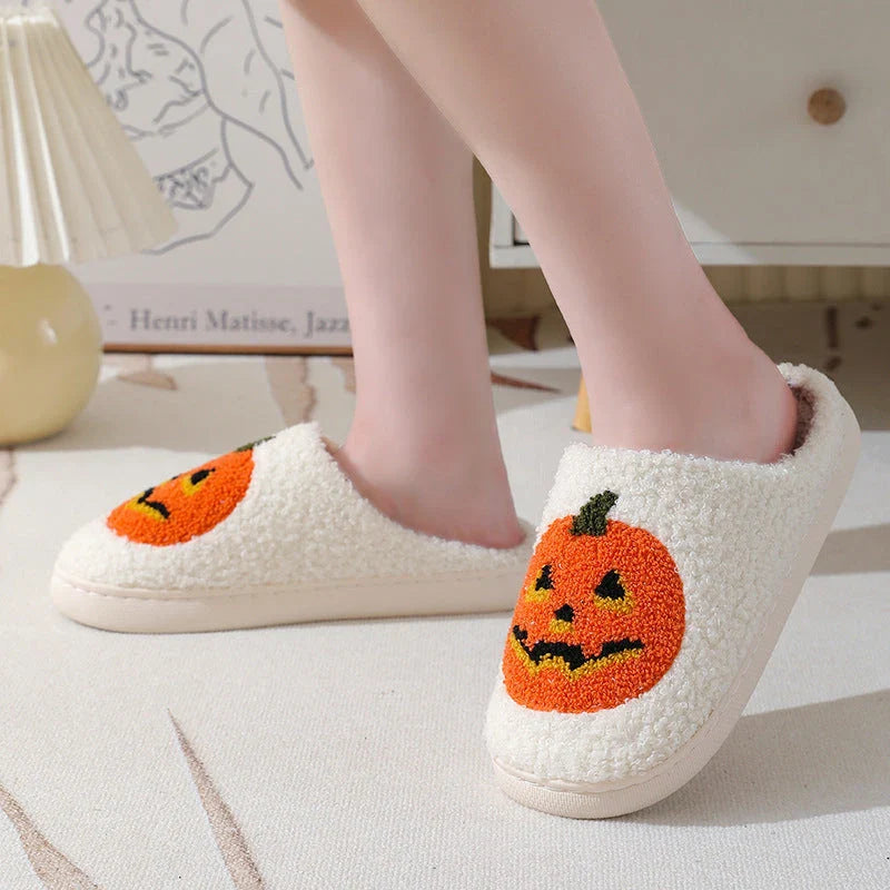 Cozy pumpkin-themed slippers with plush suede upper and non-slip rubber sole for indoor comfort