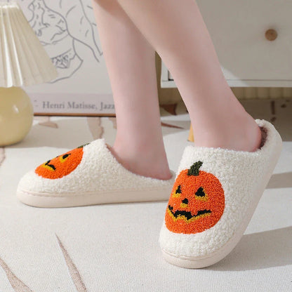 Cozy pumpkin-themed slippers with plush suede upper and non-slip rubber sole for indoor comfort