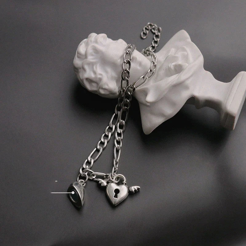 Floral heart-shaped couple bracelets with adjustable iron chains, symbolising love and friendship.
