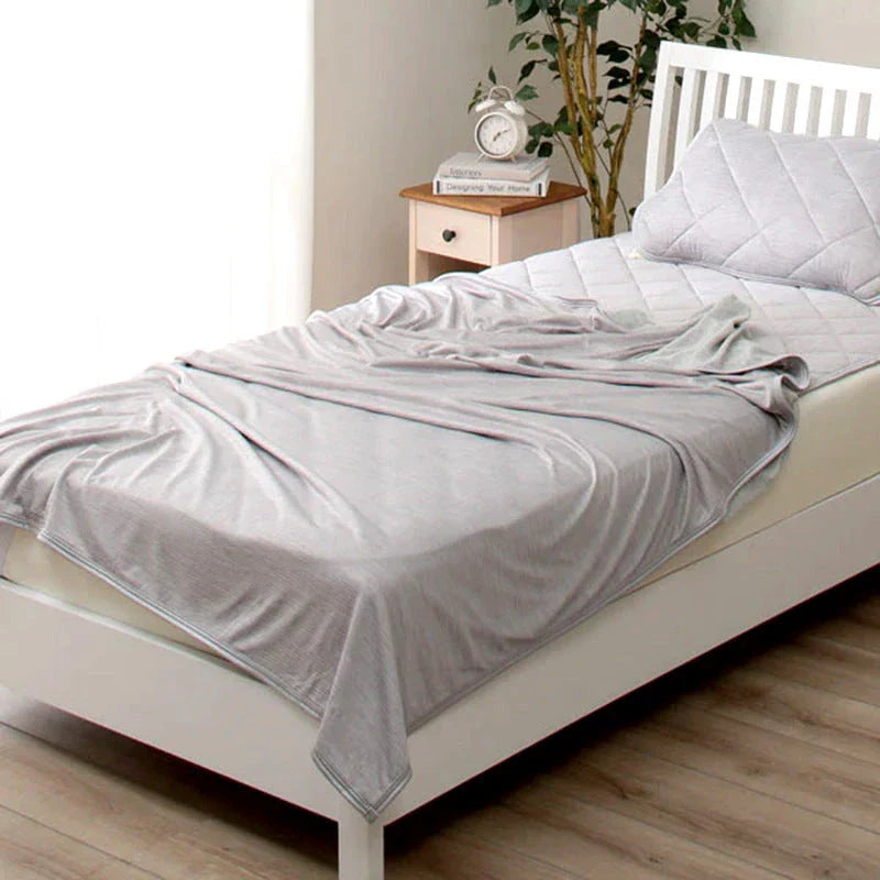 A premium polyester cooling blanket with innovative Japanese cooling fibers that provides refreshing temperature regulation for a comfortable sleep experience