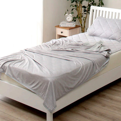 A premium polyester cooling blanket with innovative Japanese cooling fibers that provides refreshing temperature regulation for a comfortable sleep experience