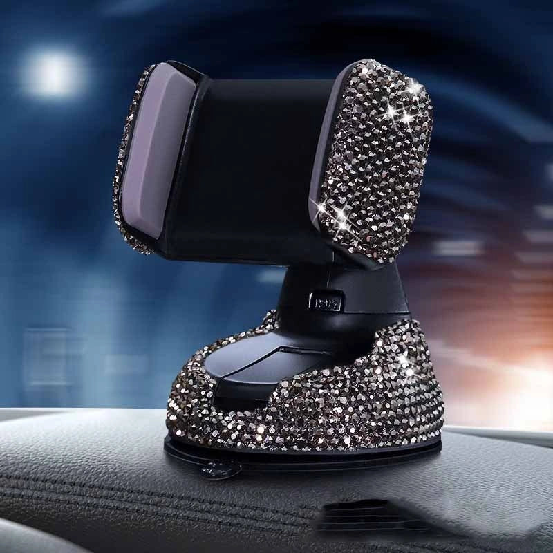 Diamond-encrusted car phone holder mounted on air vent with phone securely in place