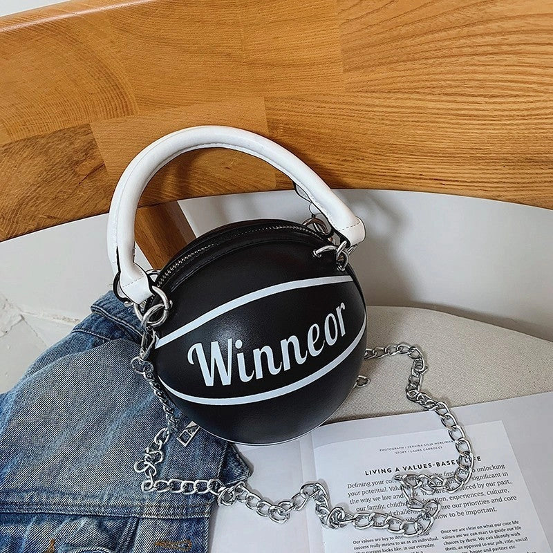 Basketball-shaped handbag in pink, white, black, or brown with adjustable chain shoulder strap
