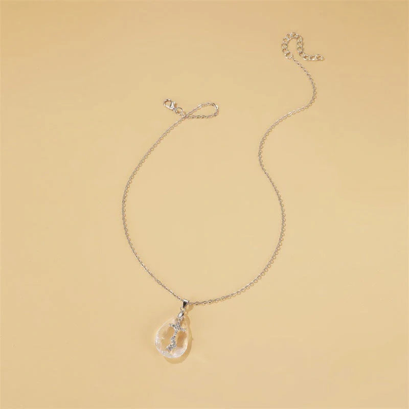 Elegant white drop pendant necklace with cross-chain design, made of premium electroplated alloy for a timeless and sophisticated look.