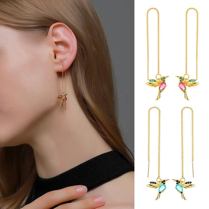Elegant hummingbird drop earrings with crystal accents, a versatile fashion accessory for British women