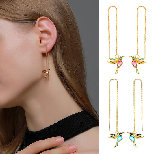 Elegant hummingbird drop earrings with crystal accents, a versatile fashion accessory for British women