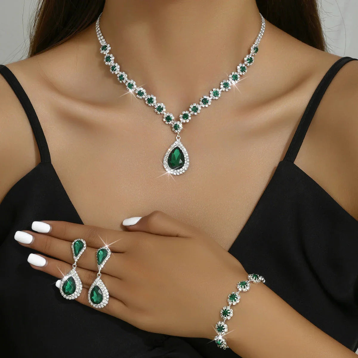 Elegant rhinestone jewelry set with necklace, earrings, and bracelet in a celestial-inspired design