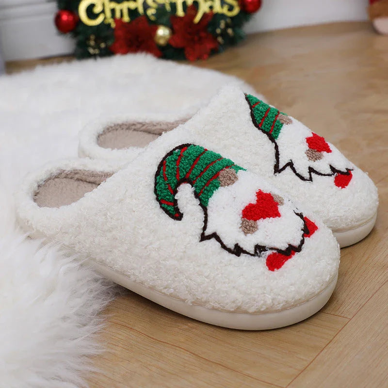 Cozy Christmas-themed slip-on slippers with a charming Santa Claus design, perfect for indoor comfort and warmth during the holiday season.