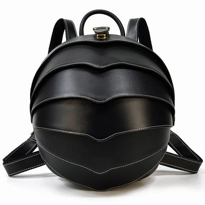 Vintage leather backpack in dark brown and black with multiple pockets