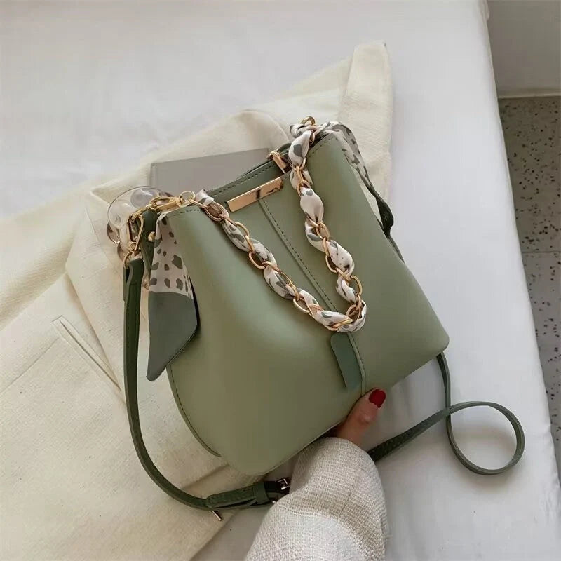 Women's PU bucket bag in white, army green, and light brown with adjustable shoulder strap