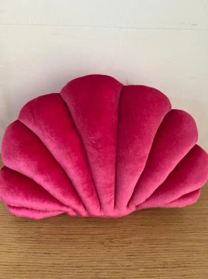 Cosy shell-shaped plush nap pillow in various colours and sizes for ultimate comfort