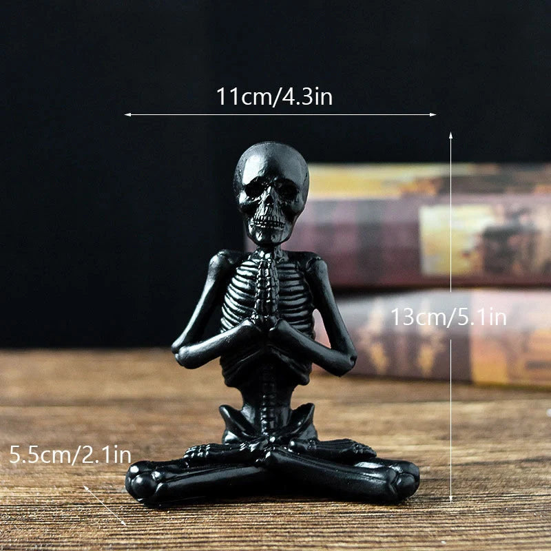 Haunting Halloween desktop ornaments, featuring intricate resin skulls and skeletons in black and vintage white finishes