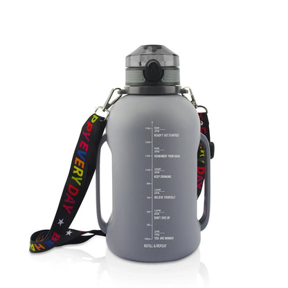 Collapsible silicone water bottle in black, green, and pink with leak-proof cap