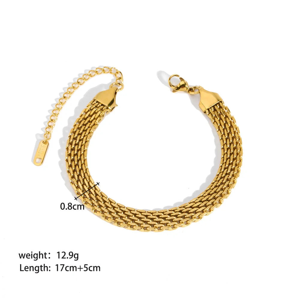 Stainless steel bracelet with real gold treatment in various colours, featuring geometry shapes and ring elements
