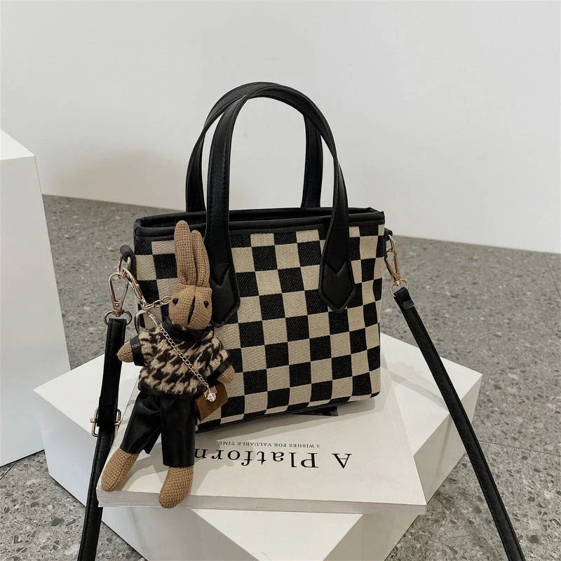 Stylish houndstooth shoulder bags in various colors, including black, coffee, and brown, with and without pendants, featuring a portable and versatile design for everyday use.