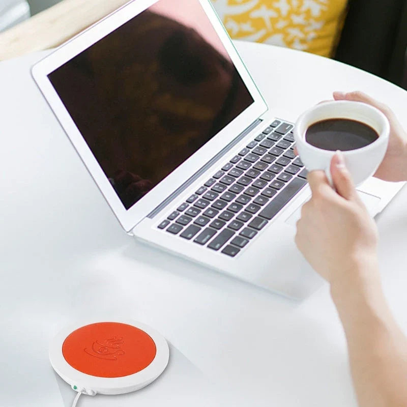 Sleek USB-powered cup warmer in various colors, keeping drinks hot and toasty