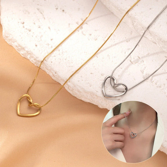 Titanium steel heart pendant necklace in gold and silver finishes, featuring an elegant and adjustable design for a customized fit